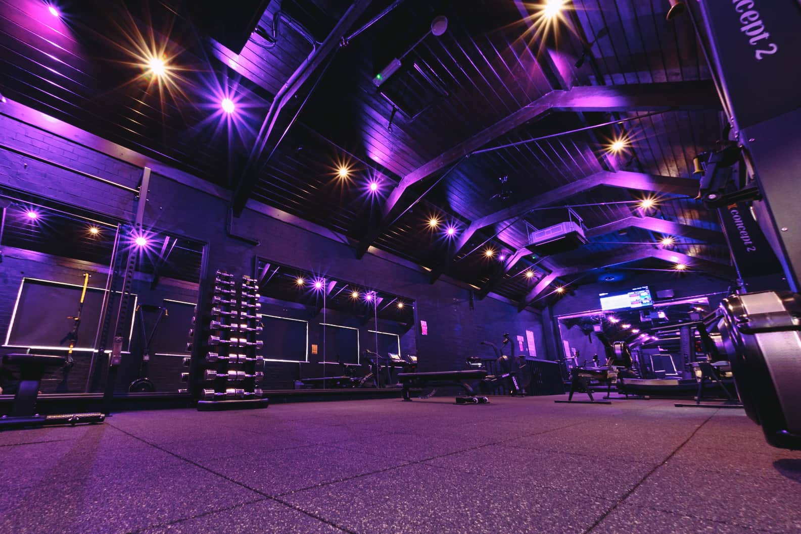 Modern gym floor with strength and cardio equipment