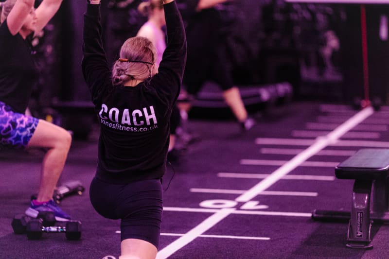 People working out together in a supportive gym environment